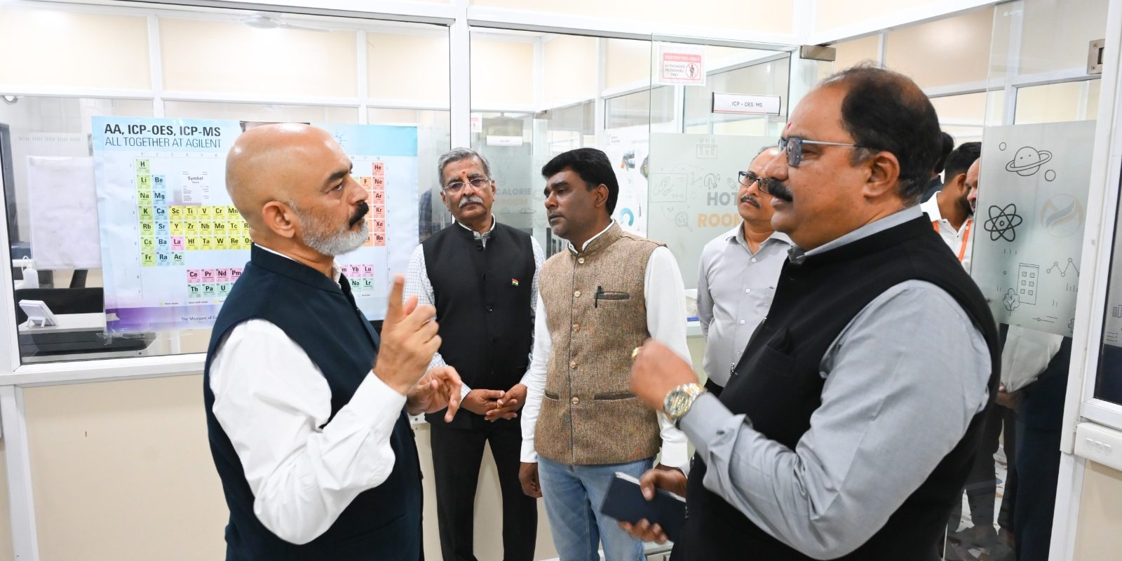 Technical Discussion — CMD Dr. Hemant Sharad Pande, Dr. Anupam Agnihotri, and Mr. Madhu K. Nair engage in a technical discussion during the visit to the TEXMiN–MaxelS Centre of Excellence’s analytical laboratory.